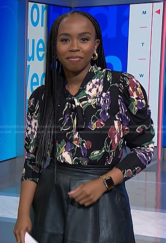 Zinhle's black floral print tie neck blouse on NBC News Daily