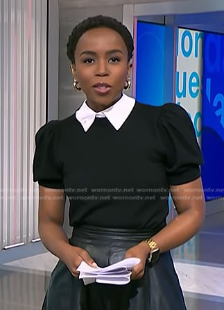 Zinhle’s black puff sleeve sweater with collar on NBC News Daily