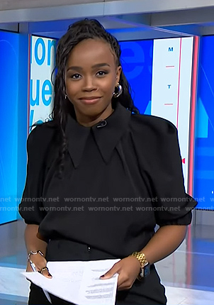Zinhle's black collared puff sleeve blouse on NBC News Daily