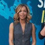 Zuri’s gray zip front vest and skirt on Access Hollywood