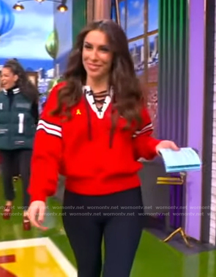 Alyssa’s red lace-up detail sweater on The View