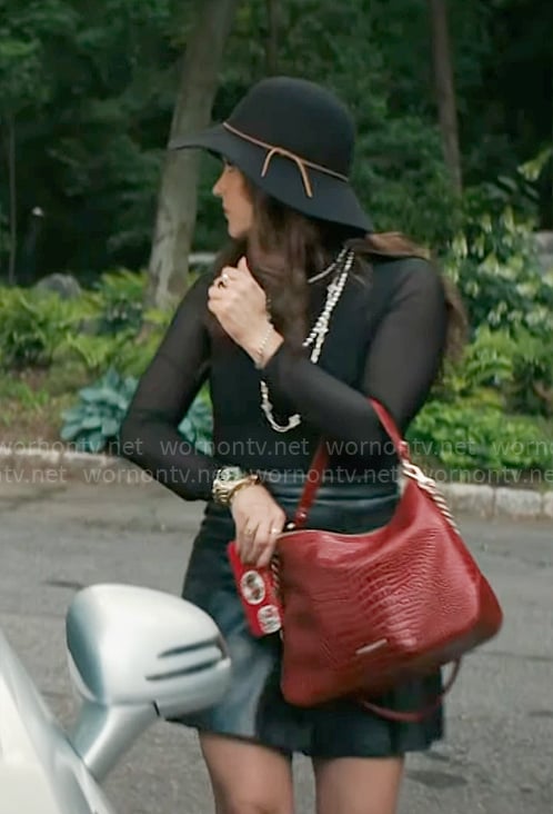 Birdie's black top, leather skirt and red bag on Grosse Pointe Garden Society