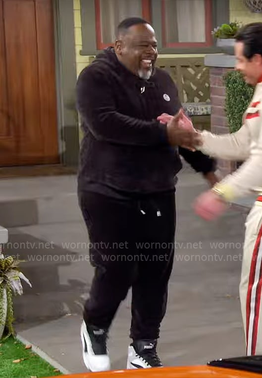 Calvin's black velour track suit on The Neighborhood