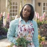 Catherine’s green striped shirt and floral apron on Grosse Pointe Garden Society