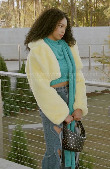 Chelsea's teal scarf top and heart cutout jeans and yellow fur jacket on Beyond the Gates