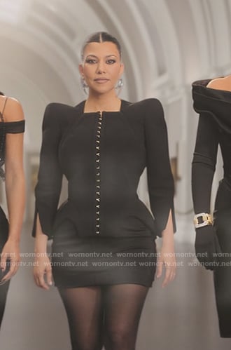 Kourtney's black puff sleeve jacket on The Kardashians