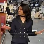 Colby Muhammad’s navy blazer and mini skirt on Access Hollywood