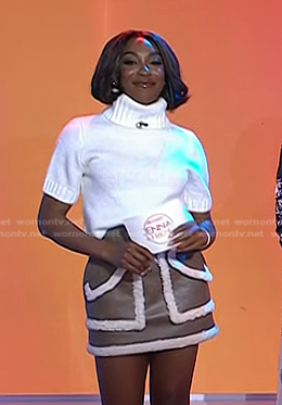 Ego Nwodim’s white short sleeve turtleneck and brown sherpa trim leather skirt on Today