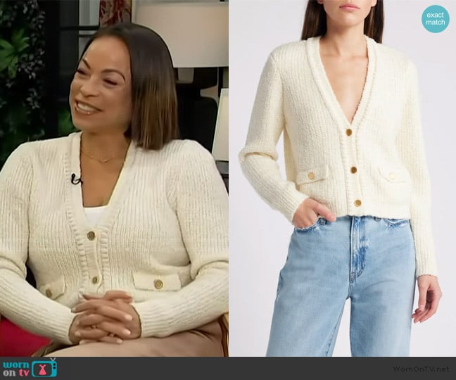 Daphnee Duplaix’s white cardigan on Access Hollywood