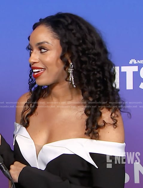 Francesca Amiker’s black contrast off shoulder dress on E! News