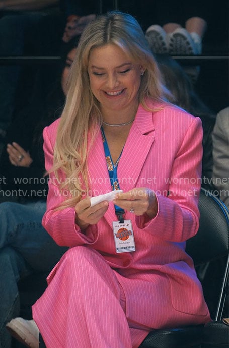 Isla's pink pinstripe suit on Running Point