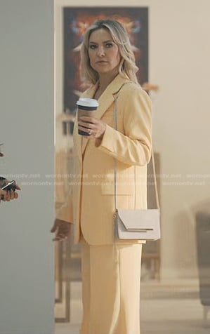 Isla’s yellow blazer and wide-leg pant suit on Running Point