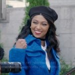 Kat’s blue layered coat on Beyond the Gates