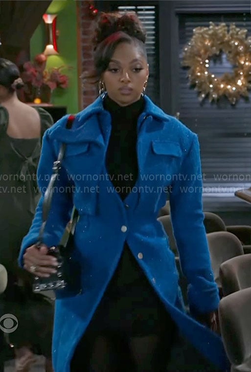 Kat's blue layered coat on Beyond the Gates