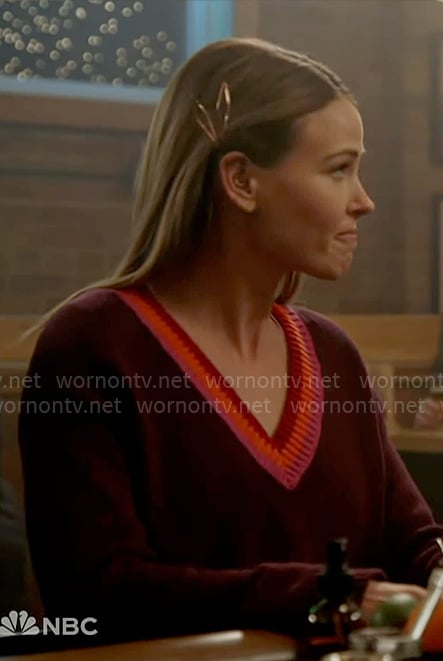 Lyla's burgundy sweater with stripe v-neckline on Chicago Fire