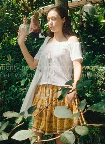 Milla's white off-shoulder top and yellow printed skirt on Apple Cider Vinegar