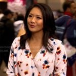 Nancy Chen’s white floral wrap blouse on CBS Saturday Morning