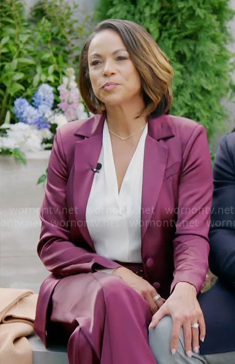 Nicole’s burgundy satin suit on Beyond the Gates