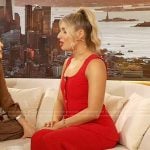 Sabrina Brier’s red sleeveless jumpsuit on The Drew Barrymore Show