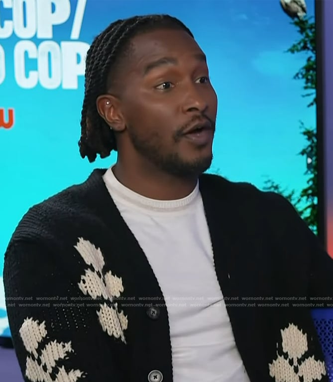 Scott’s black floral cardigan on Access Hollywood