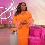 Sherri’s orange feather cuff dress on Sherri