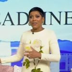 Tamron’s white floral print long sleeve mini dress on Tamron Hall Show