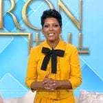 Tamron’s yellow tie neck top and skirt on Tamron Hall Show