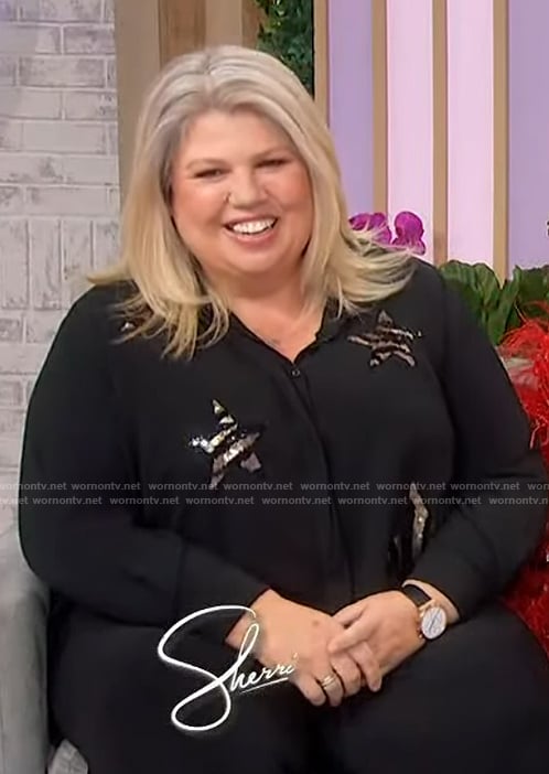 Urzila Carlson’s black star blouse on Sherri