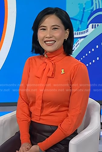 Vicky's orange tie neck knit top on Today