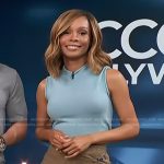 Zuri’s blue sleeveless sweater and brown wrap skirt on Access Hollywood