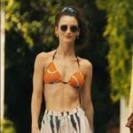 Chloe’s orange belt print bikini and black and white pants on The White Lotus