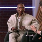 Cynthia Erivo’s white crop tank and leather jacket on The Voice