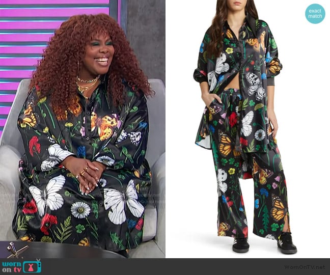 Amber Riley’s black floral print shirt and pants on Access Hollywood