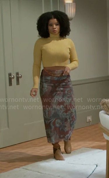 Eva’s yellow cropped turtleneck and printed mesh skirt on Beyond the Gates