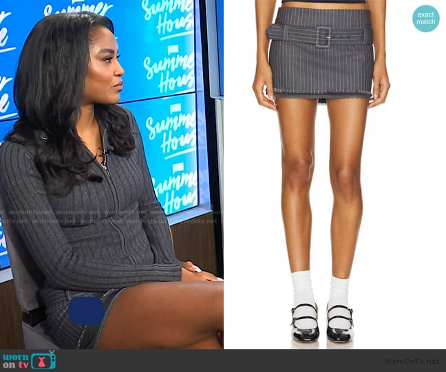 Ciara Miller’s gray stripe mini skirt on E! News