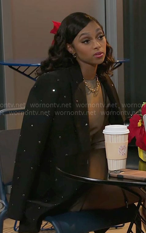 Kat's black studded coat on Beyond the Gates