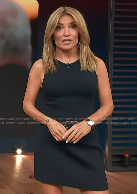 Kit's navy belted mini skirt on Access Hollywood