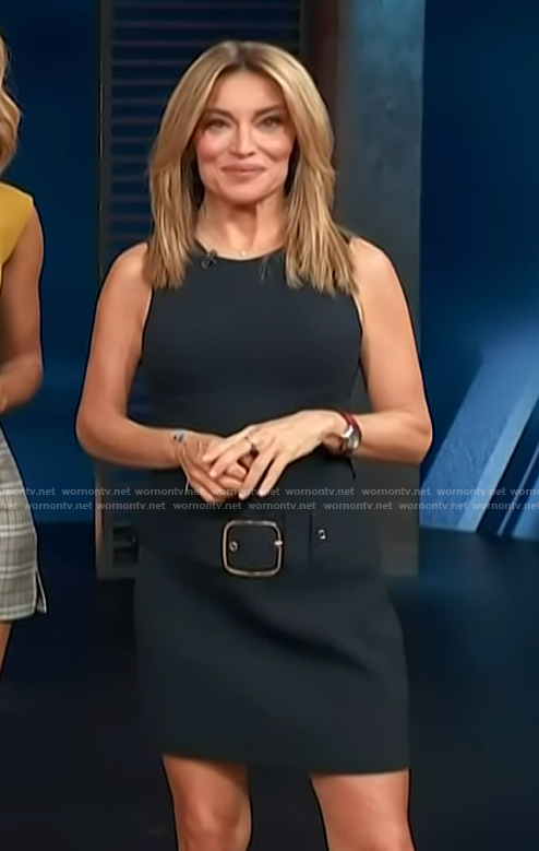 Kit's navy belted mini skirt on Access Hollywood