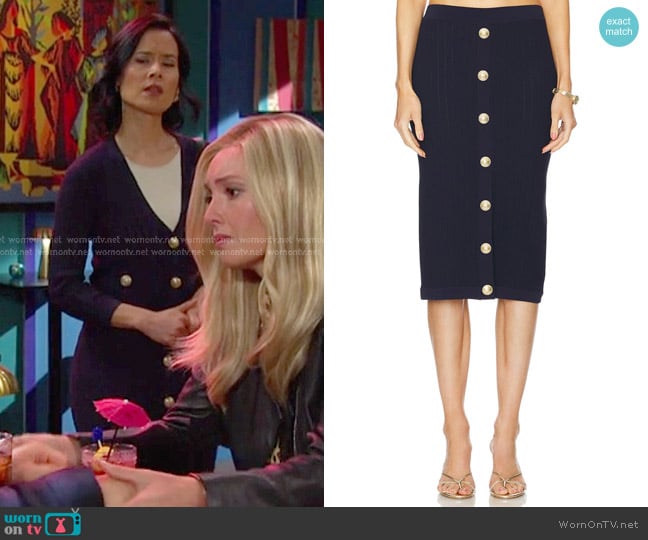 Amy Choi’s navy knit skirt with gold buttons on Days of our Lives