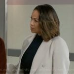 Nicole’s light grey coat on Beyond the Gates