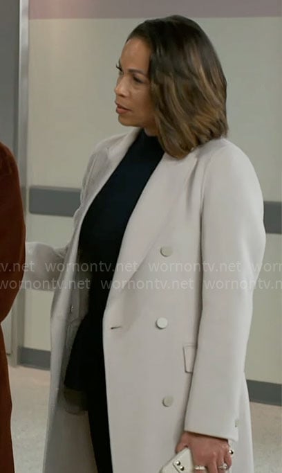 Nicole’s light grey coat on Beyond the Gates