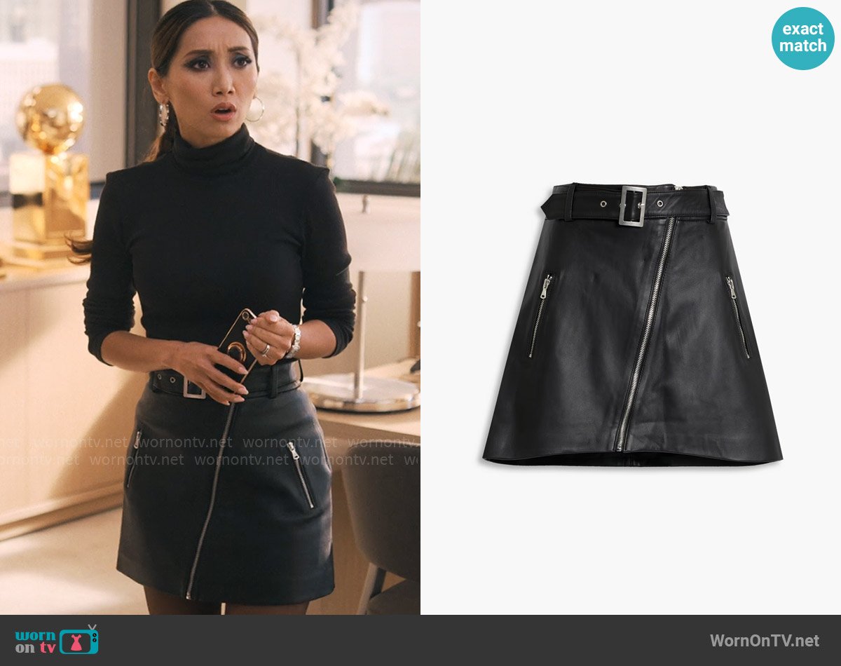 Ali’s black leather mini skirt with zips on Running Point