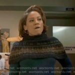 Angie’s grey fair isle capelet sweater on Will Trent