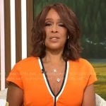 Gayle King’s orange v-neck dress with black trim on CBS This Morning