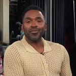 Justin’s yellow crochet knit shirt on E! News