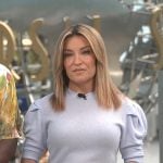 Kit’s blue puff sleeve top on Access Hollywood