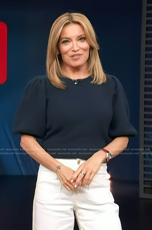Kit’s navy puff sleeve sweater on Access Hollywood