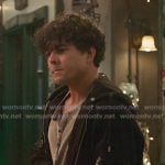 Lucas Adams’s grey henley shirt and black jacket on Greys Anatomy