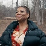 Robyn’s painted print shirt and pants set with black coat on The Equalizer