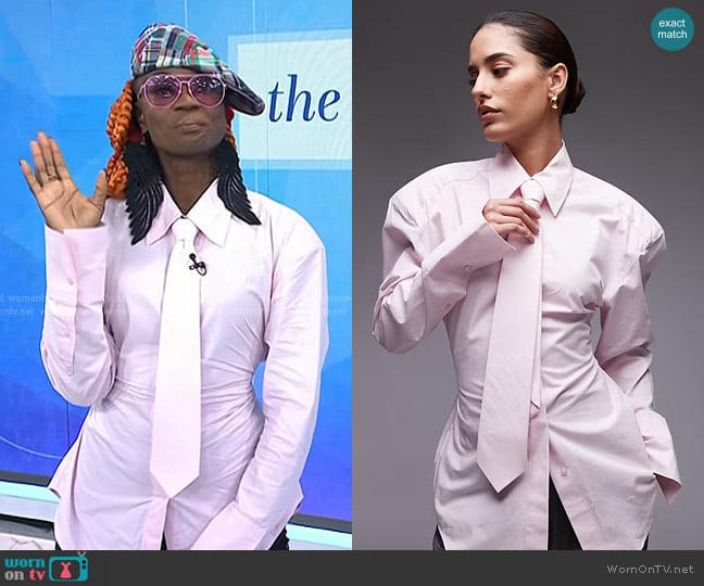 Asos Cinch Waist Shirt with Shoulder Pads and Necktie in pink worn by Caroline A. Wanga on Today